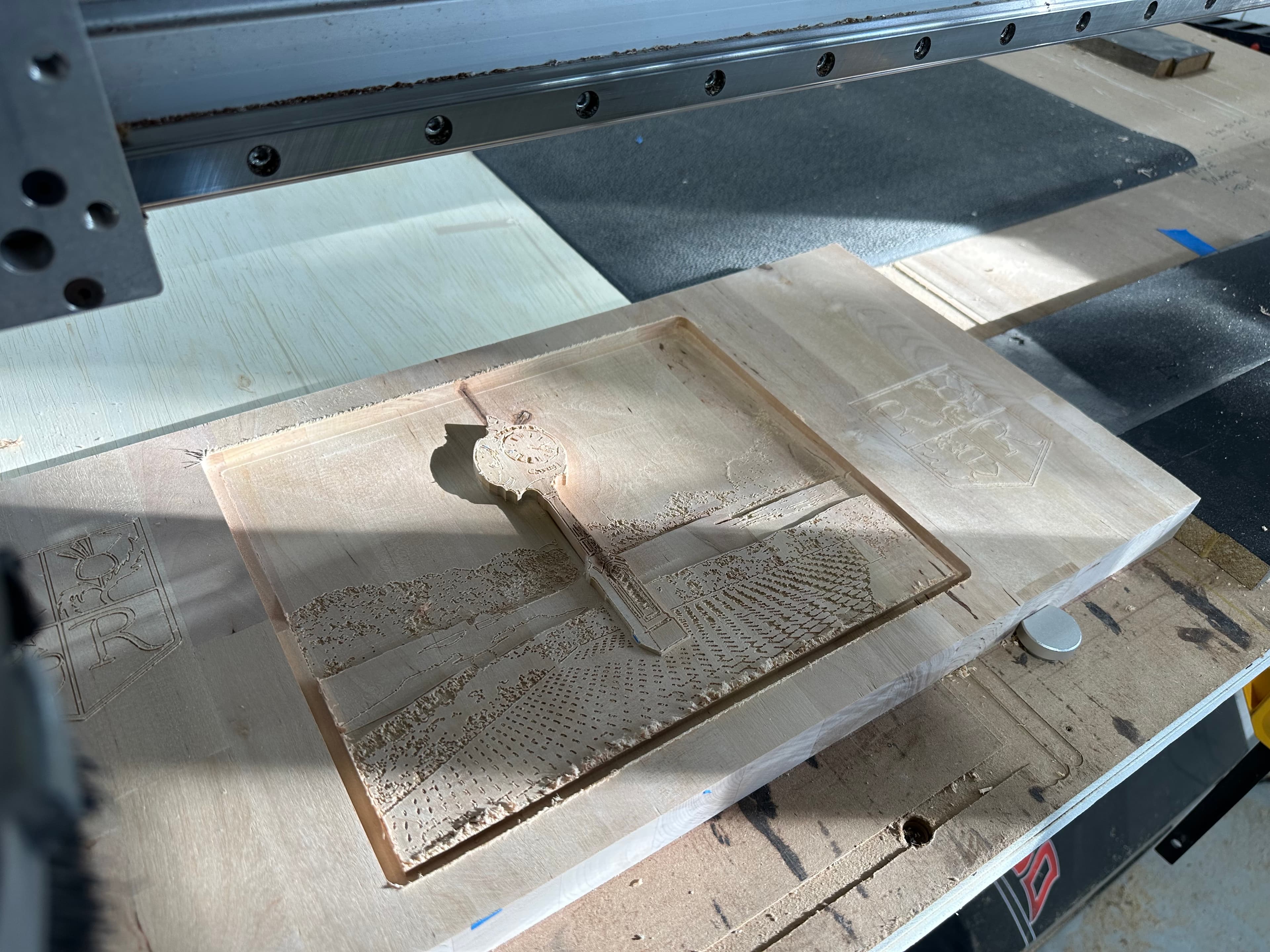 CNC router carving a relief panel on the bed at the Lineage Craft Co. shop